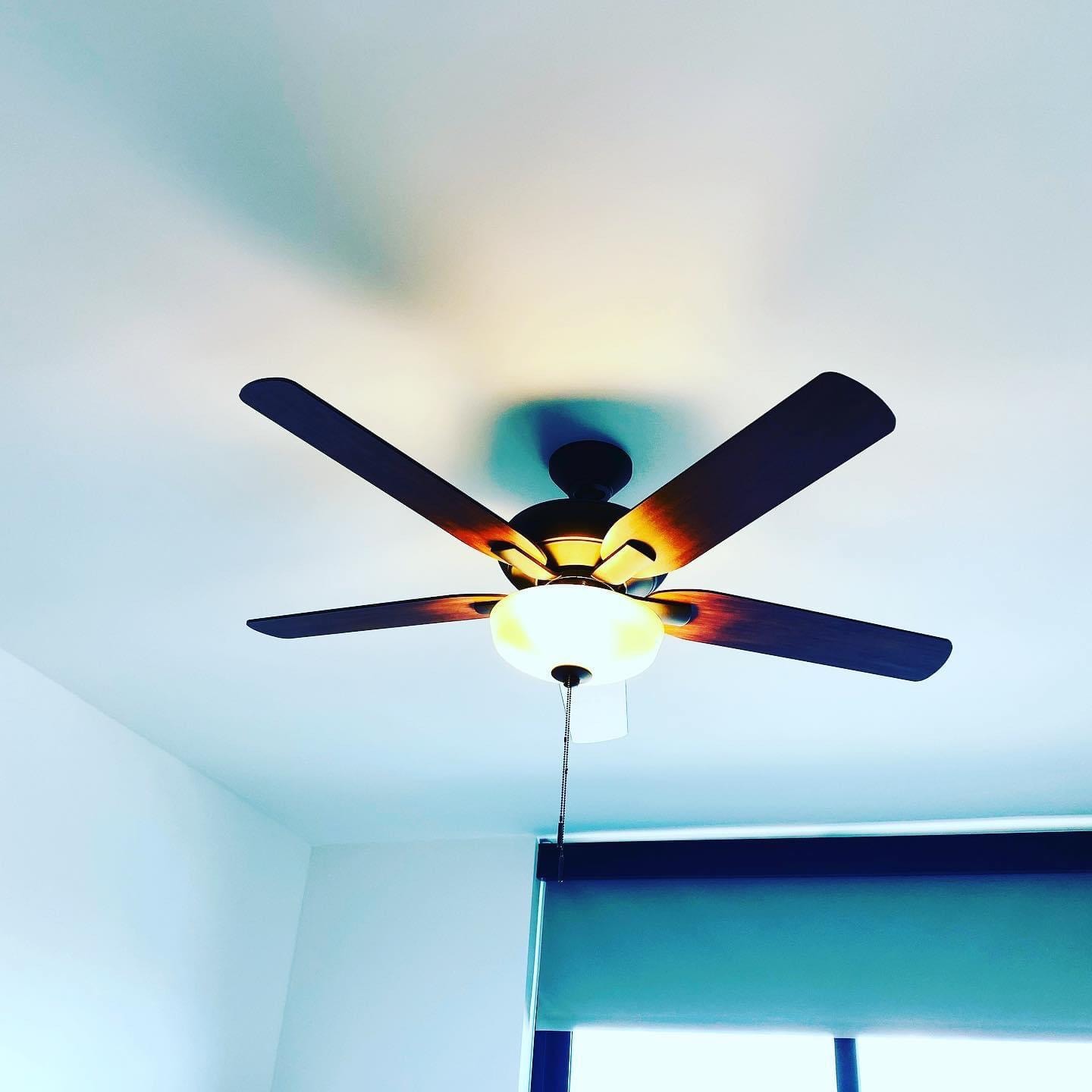 Professional ceiling fan installation in a bright Florida home
